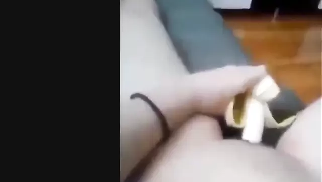 Muslim woman jerking off with a banana